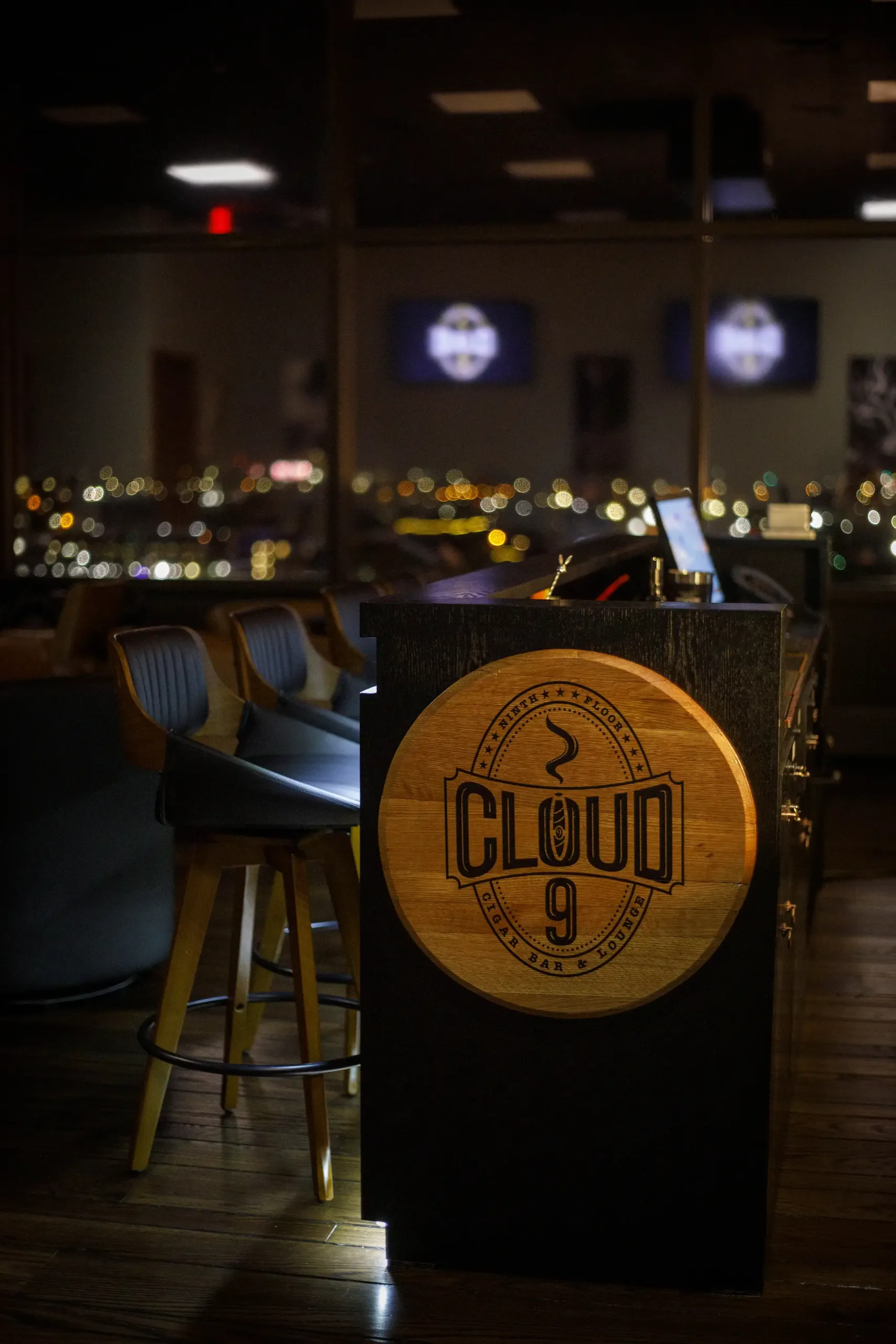 Cloud 9 cigar lounge entrance sign and bar seating